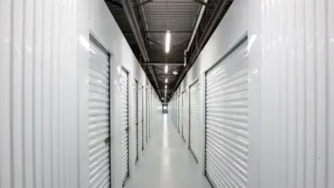 Self storage unit hallway, white doors and hallway